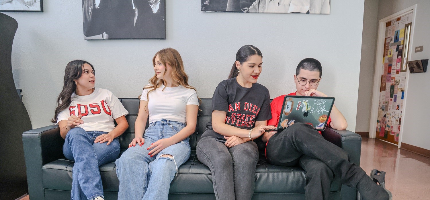 Four SDSU Imperial Valley students seating down on a sofa